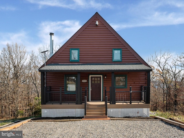 log home with covered porch