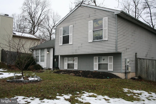 tri-level home with a lawn