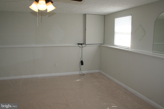 unfurnished room with ceiling fan