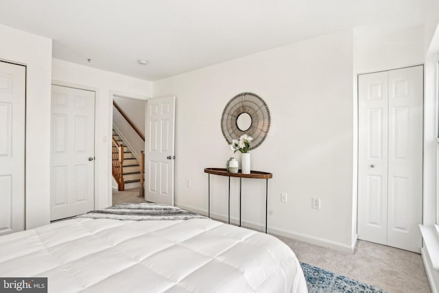 bedroom featuring light carpet