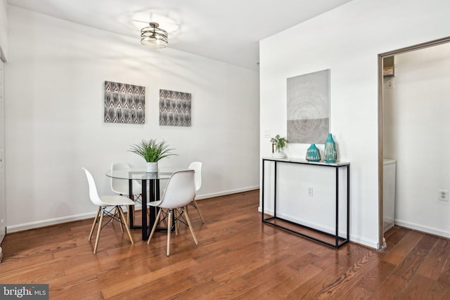 dining space featuring wood-type flooring