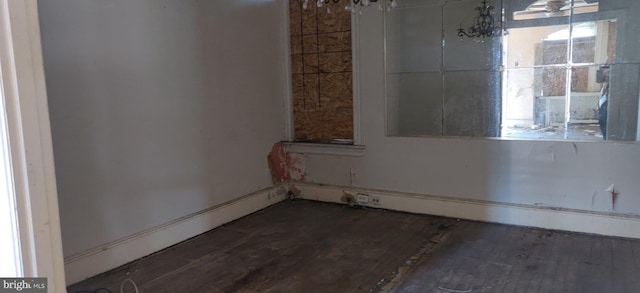 empty room featuring dark hardwood / wood-style flooring