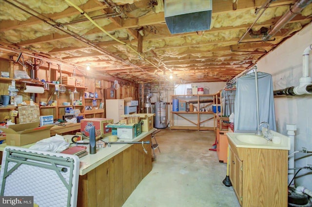 basement with water heater and sink