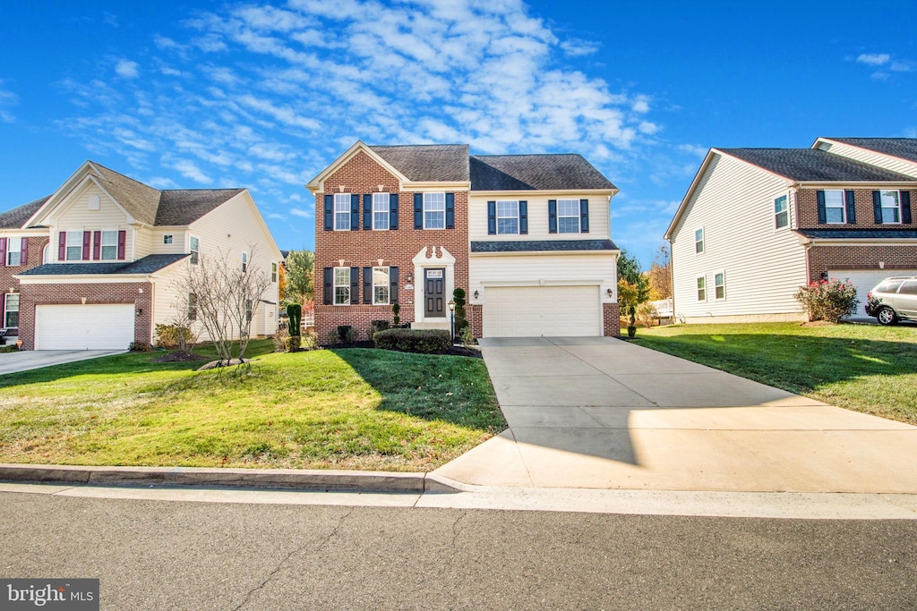 view of front of home featuring a front lawn and a garage