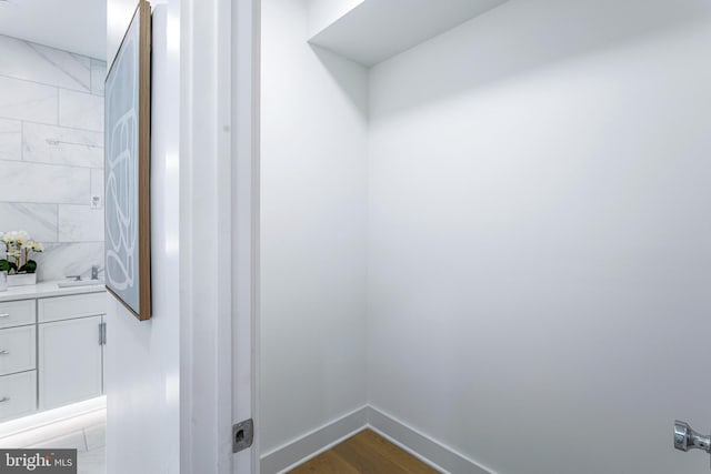 bathroom featuring vanity and wood-type flooring