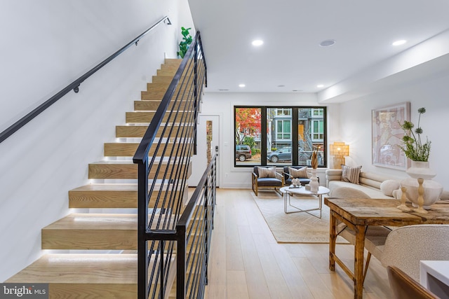 stairway featuring hardwood / wood-style floors