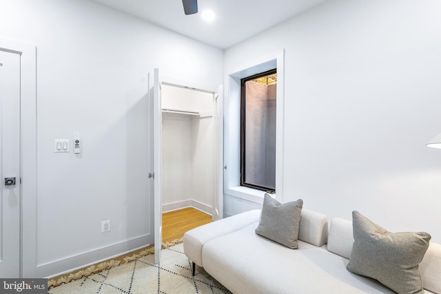 bedroom with ceiling fan, a closet, and light wood-type flooring