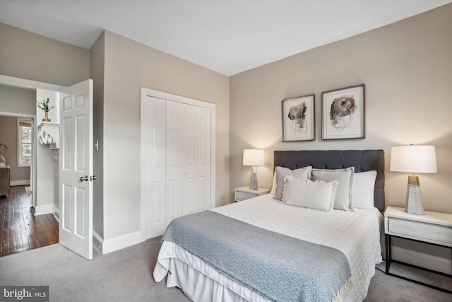 bedroom featuring hardwood / wood-style floors and a closet