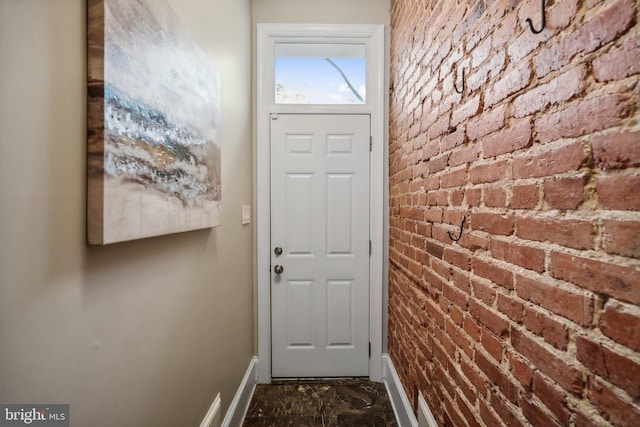 doorway with brick wall