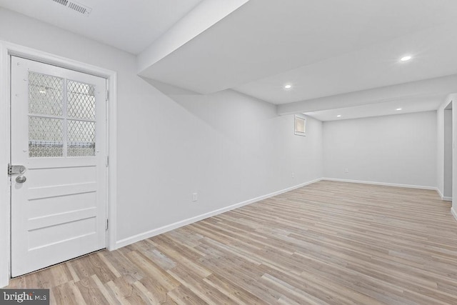 basement featuring light wood-type flooring