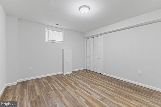 basement featuring light hardwood / wood-style floors