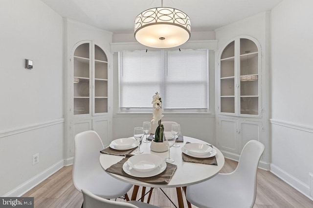 dining room with light hardwood / wood-style flooring