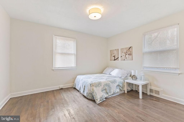 bedroom featuring wood-type flooring