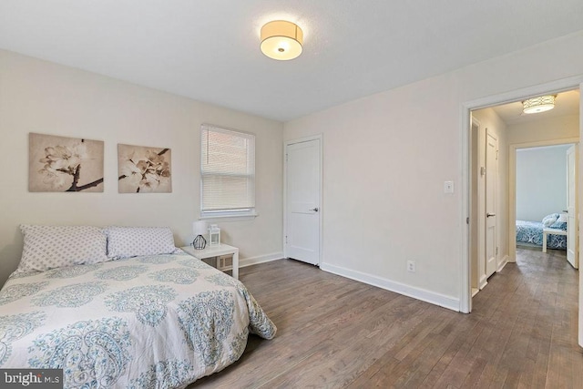 bedroom with wood-type flooring