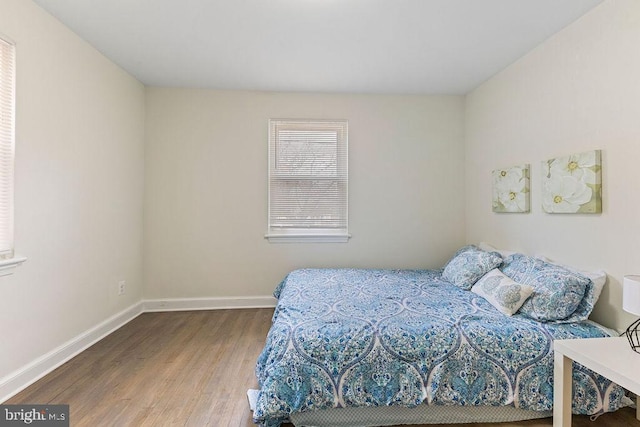 bedroom with wood-type flooring