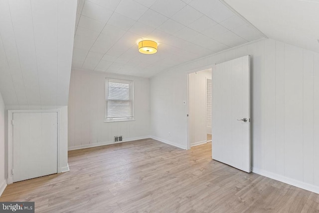 bonus room featuring light hardwood / wood-style floors and lofted ceiling