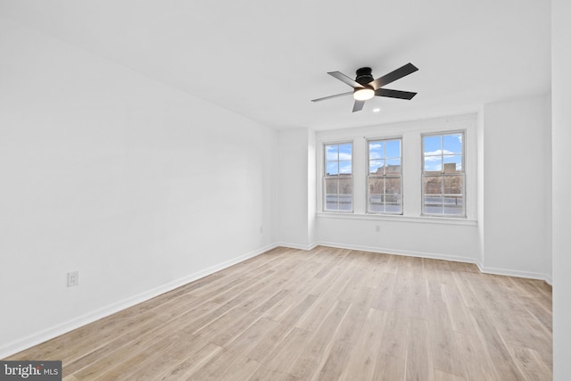 unfurnished room featuring light hardwood / wood-style flooring and ceiling fan