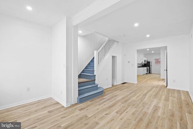 unfurnished living room featuring light hardwood / wood-style flooring