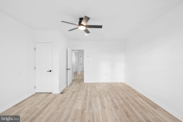 unfurnished room featuring ceiling fan and light wood-type flooring