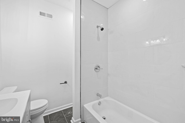 full bathroom with tile patterned floors, vanity, toilet, and tiled shower / bath