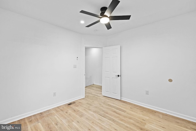 unfurnished room featuring ceiling fan and light hardwood / wood-style flooring