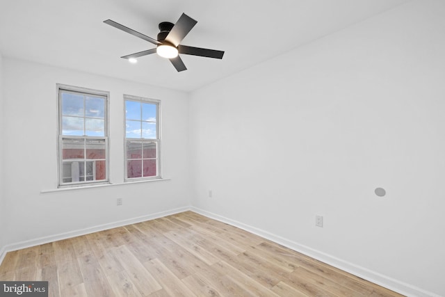 unfurnished room featuring light hardwood / wood-style flooring and ceiling fan