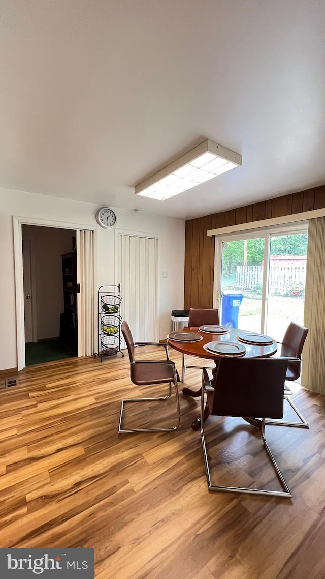 dining space with light hardwood / wood-style floors