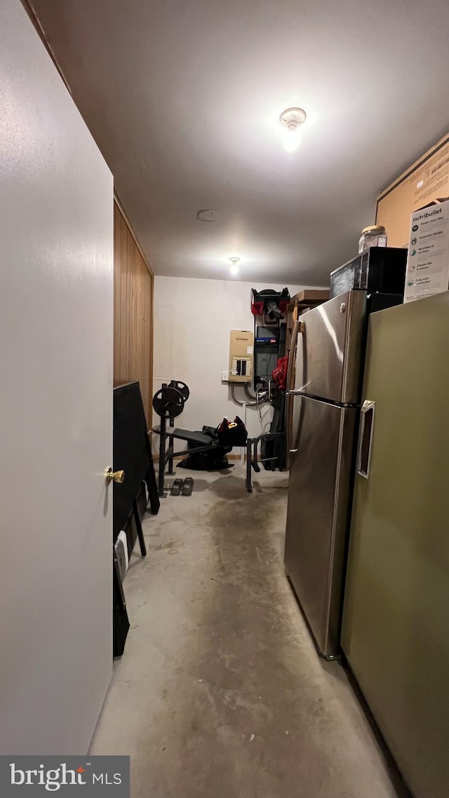 basement with stainless steel fridge