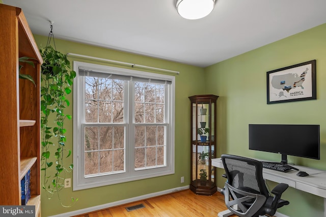 office space with light hardwood / wood-style floors