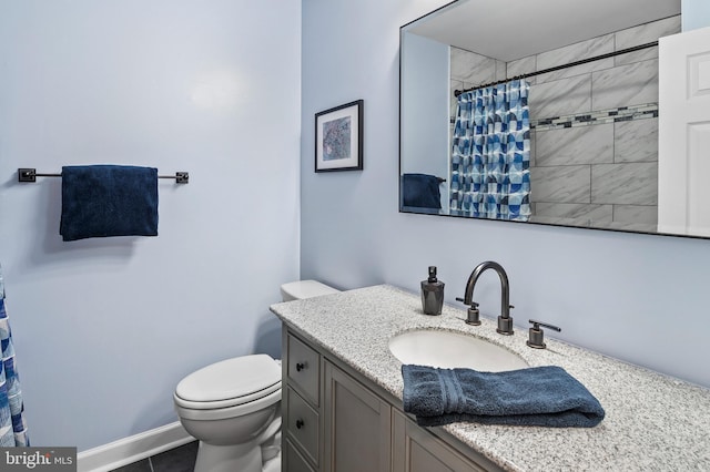 bathroom with tile patterned flooring, vanity, toilet, and walk in shower