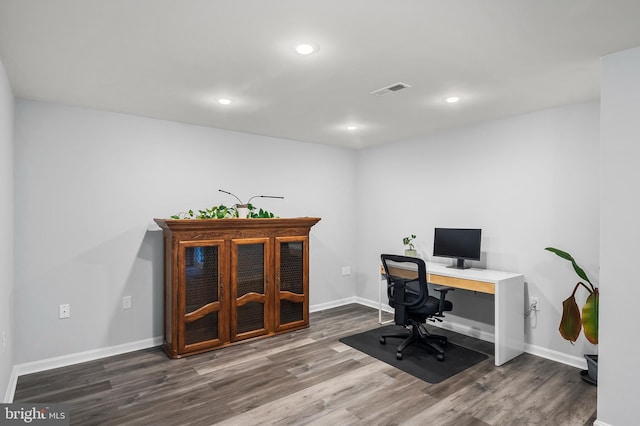 office space with dark hardwood / wood-style flooring