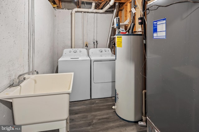 laundry room with washer and dryer, electric water heater, and sink