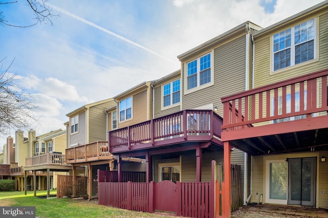 back of property featuring a wooden deck