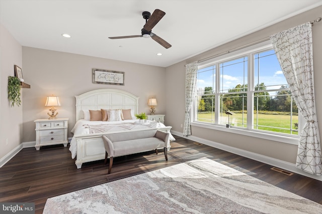 bedroom featuring ceiling fan and dark hardwood / wood-style flooring