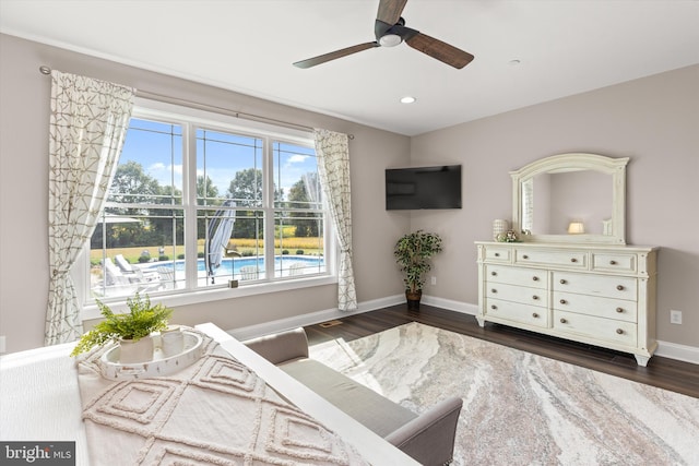 bedroom with ceiling fan and dark hardwood / wood-style flooring