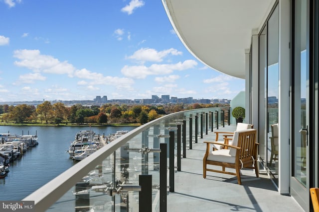 balcony featuring a water view