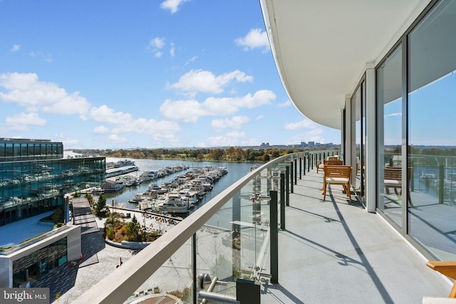 balcony featuring a water view