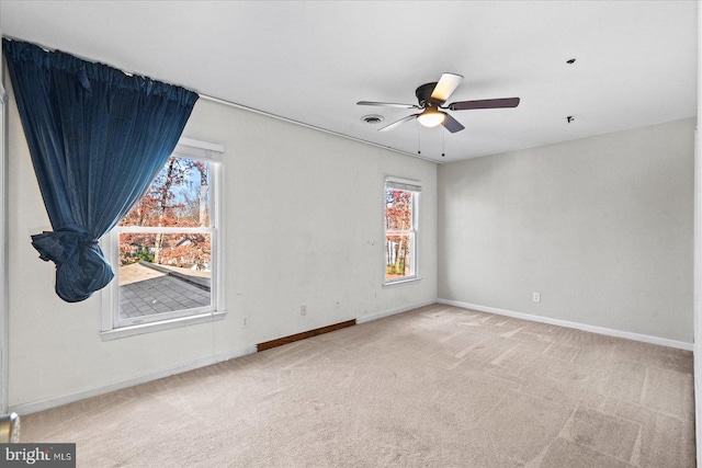 carpeted empty room with ceiling fan