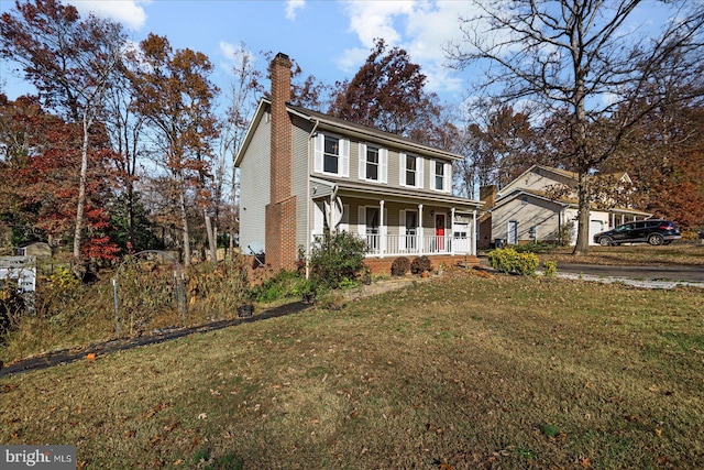 view of front of home with covered porch and a front yard