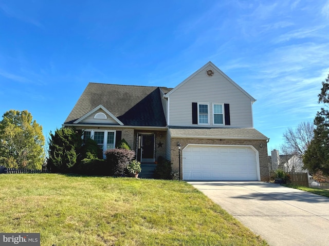 view of front of home with a front yard and a garage