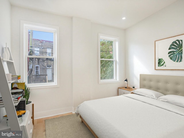 bedroom with wood-type flooring