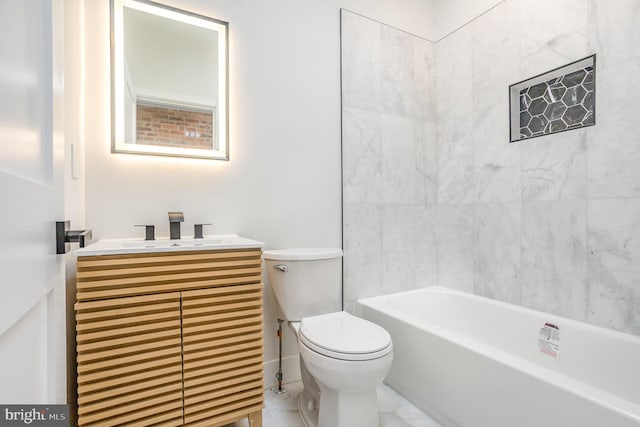 full bathroom featuring vanity, toilet, and tiled shower / bath