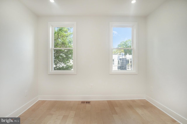 unfurnished room featuring light hardwood / wood-style floors