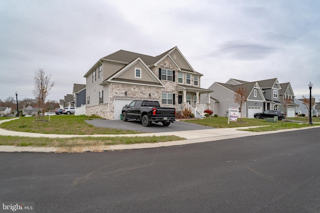 view of front facade featuring a garage and a front yard