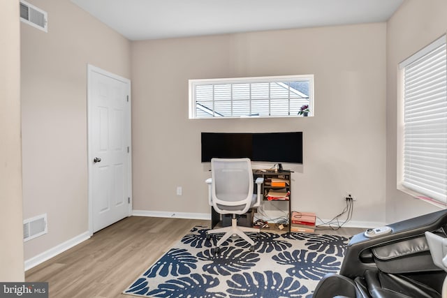 office with light hardwood / wood-style floors