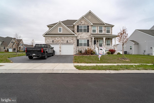 view of front of home with a front lawn and covered porch