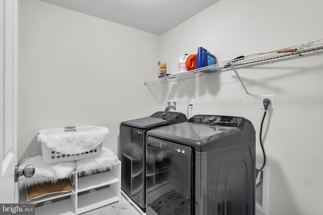 laundry area with separate washer and dryer