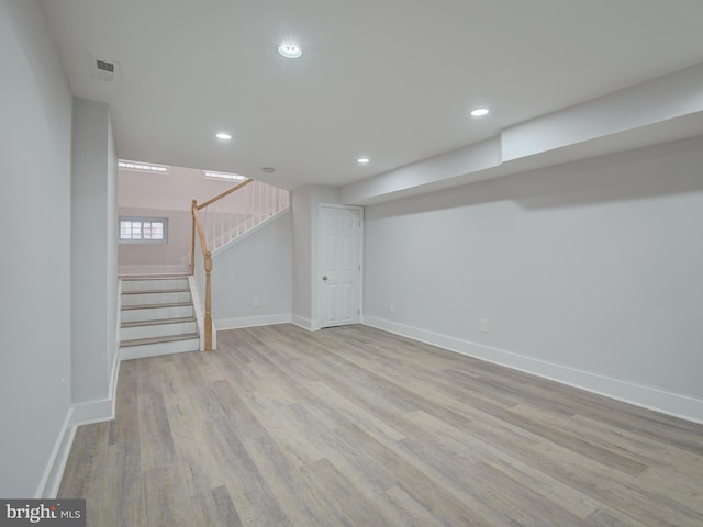 basement featuring light wood-type flooring