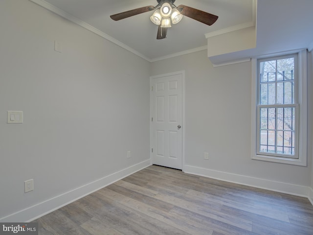 unfurnished room with ceiling fan, ornamental molding, and light hardwood / wood-style flooring