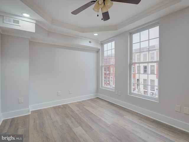 empty room with light hardwood / wood-style flooring, ceiling fan, and ornamental molding